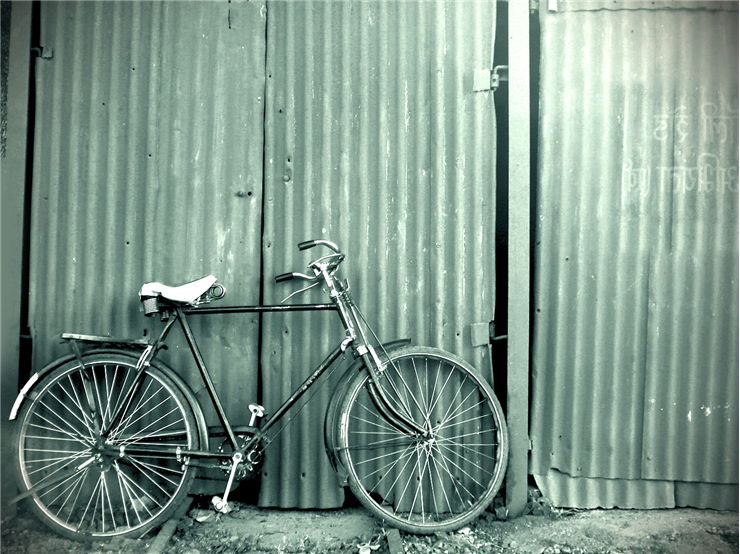 Picture Of Old Bike And Garage Door